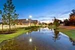 Houston Community College’s Felix Fraga Campus: Pedestrian pathways and lighting along a bioswale, which collects and filters water on site before returning it to the stormwater system, makes it a landscape feature and not just an oversized drainage ditch.