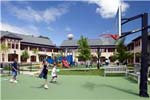 At the Hackley School in Tarrytown, NY, the south-facing courtyard for play is surrounded by the single-loaded corridor so that the children are easily observed by the staff and other students.