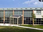 Detail of the Student Center at Manhattanville College in Purchase, NY, with solar collectors on the roof. Peter Gisolfi, architect for the project, says that 15 percent of the electrical energy for the building is supplied by the sun, while the building itself consumes approximately 50 percent less energy than a typical code-compliant building.