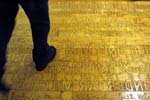 Ann Hamilton Studio’s 7,200-square-foot maple flooring design in the Seattle Public Library includes 1,543 sentences in books published in 11 languages.