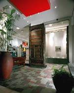 The entrance to The North Face Beverly Hills is a vestibule highlighted by a 200-year-old, hand-carved Indonesian door and cascading water wall.