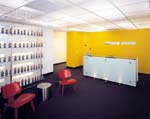 Campbell Mithun's lobby/reception area features a wall painted in the agency's signature yellow that is also central to their logo and graphic identity.