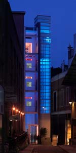 The new entrance and tower at Geoffrey Reid Associates headquarters comes to life at night with sculptural lighting.