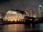 The Esplanade - Theatres on the Bay glows against the Singapore skyline.