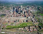 A 2006 aerial view of Denver shows Central Platte Valley with the new 30-acre Commons Park in the foreground; Riverfront Park (then under construction) on the park’s upper edge. Beyond (but low) is Denver Union Station and the rest of the LoDo warehouse district; Coors Stadium is far left. The Denver central business district rises in the background